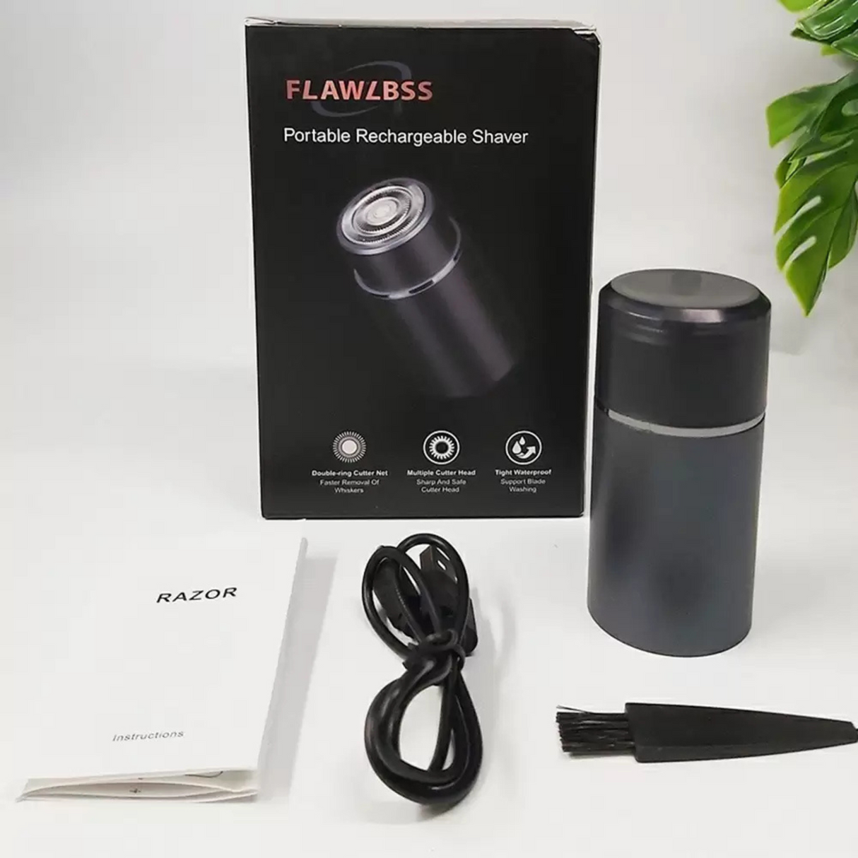 Portable rechargeable shaver with packaging and accessories on a white background