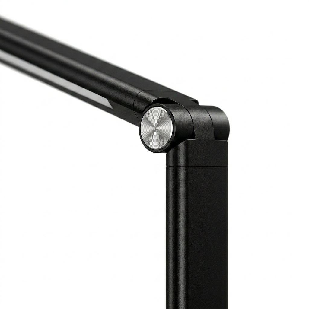 Close-up of Harmonic LED Table Desk Lamp hinge showing metal joint and sturdy build. The pivot allows smooth angle adjustment.