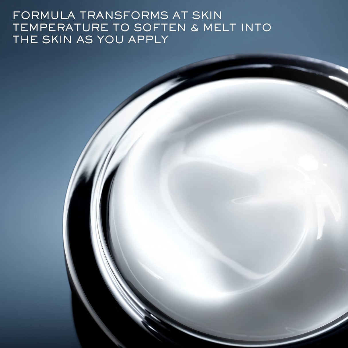 Close-up of Lancome Genifique Night Repair Cream texture inside the jar. The cream appears smooth and melts into skin upon application.