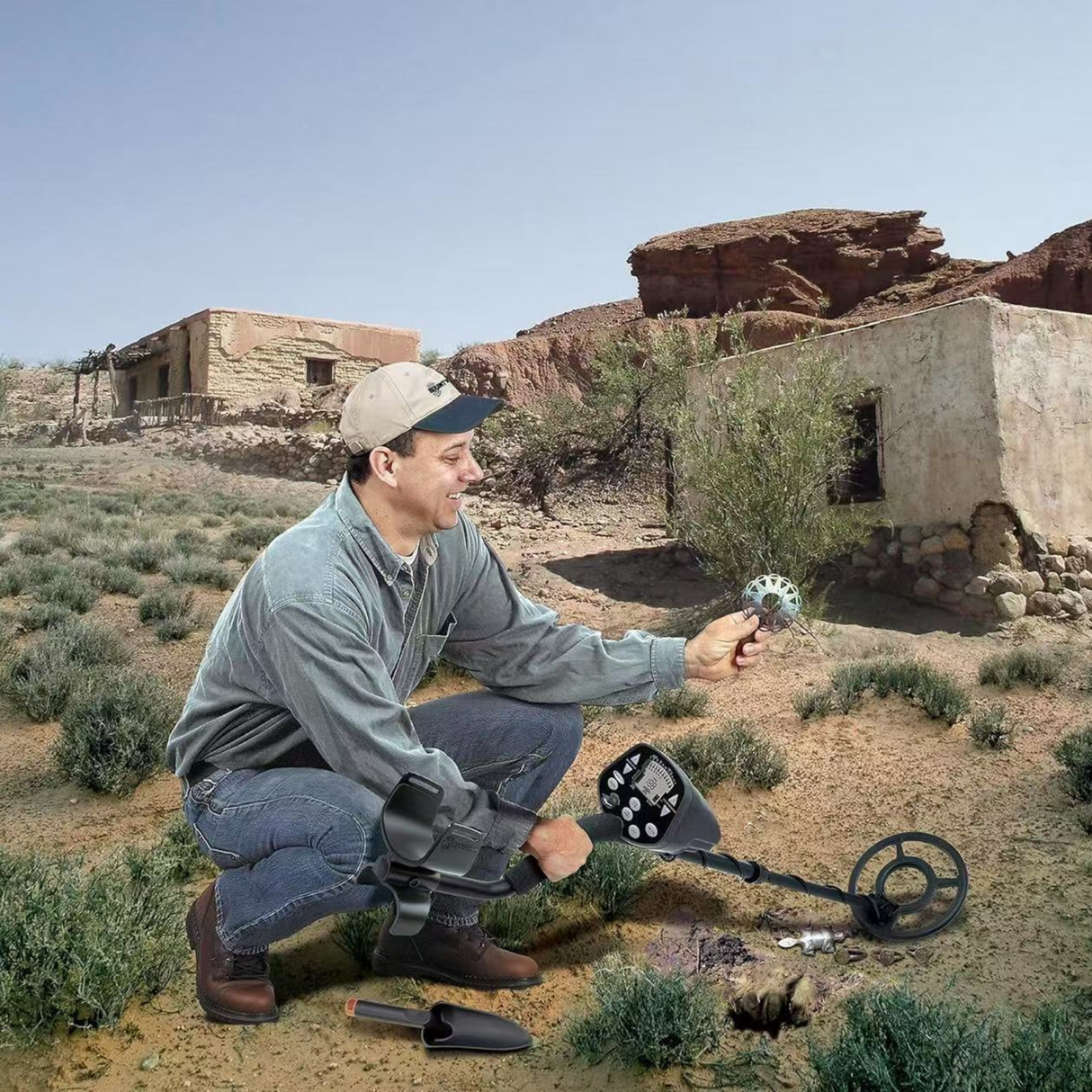 Person using a metal detector in a desert area, discovering an object buried in the ground.
