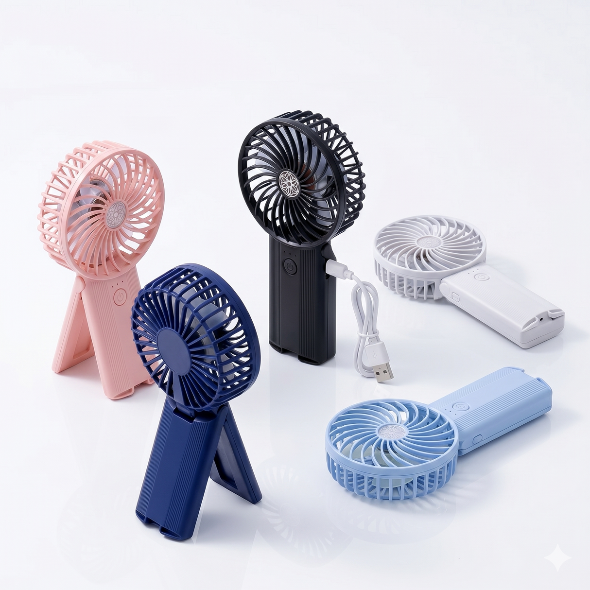 Hand holding compact rechargeable handheld fan on stand