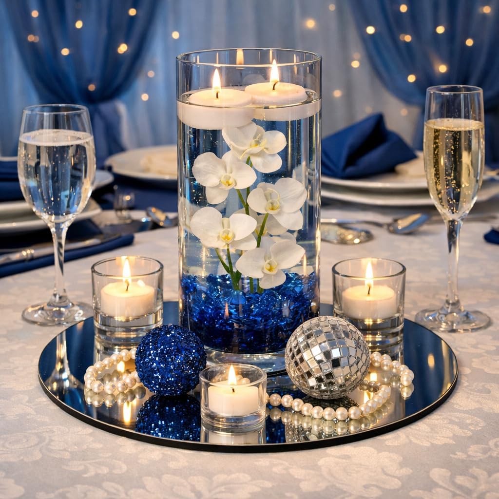 Round mirror centerpiece tray set with candles and floral arrangement on table