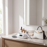2-in-1 facial skin care device on bathroom counter with handheld applicator