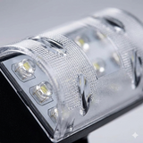 This close-up highlights the textured lens and internal LED components of a high-quality solar landscape light. The shallow depth of field emphasizes the intricate diamond-pattern diffuser designed for optimal light dispersion and durability.