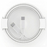 A white USB-C cable, with two connector ends exposed, is coiled neatly inside its white, circular cardboard spool and holder.