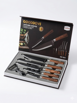 angled view of kitchen knife set showing multiple blade types and wood handles