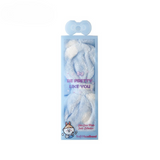 Blue polka dot coral fleece bow headband packaged for skincare use