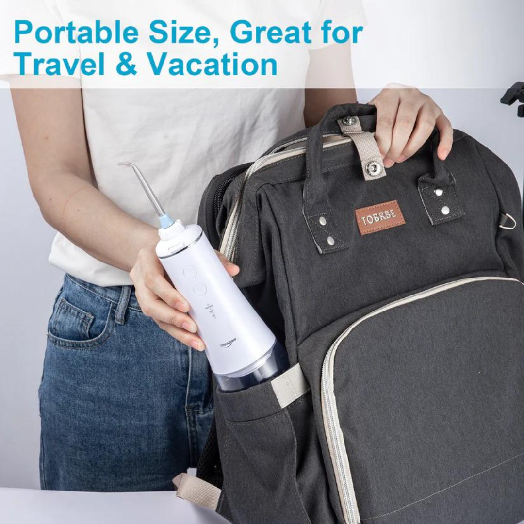 Cordless Water Flosser placed in a backpack pocket showing portable size for travel. The device is compact and easy to carry on trips.