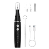 Dental calculus remover kit with electric scaler, mirror, tips, and USB cable. Complete dental cleaning tool set displayed on white background.