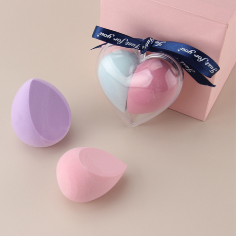 Two-tone heart-shaped makeup sponge with soft texture for smooth blending and contouring.