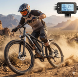 Rider using EDIKANI electric mountain bike on rugged trail with speed display