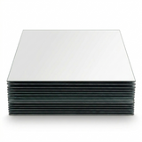 Stack of frameless mirror tile set squares neatly arranged. 8-inch mirror tiles with a sleek reflective surface.