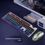 RGB gaming keyboard and mouse set on a desk with monitor. Backlit keyboard enhances gaming setup aesthetics.