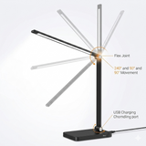 Harmonic LED Table Desk Lamp demonstrating adjustable flex joint with multiple angle positions. The image shows wide rotation and USB charging port.