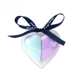 Heart-shaped sponge case with blue and purple dual-color makeup blender inside and decorative ribbon.