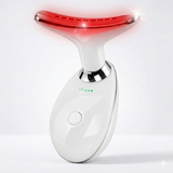 LED face and neck massager glowing red during operation. Smooth handheld device designed for anti-aging skincare routines.