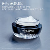 Close-up of Lancome Advanced Genifique Eye Cream jar with visible cream texture. Text indicates improved moisture and plumper skin around the eyes.