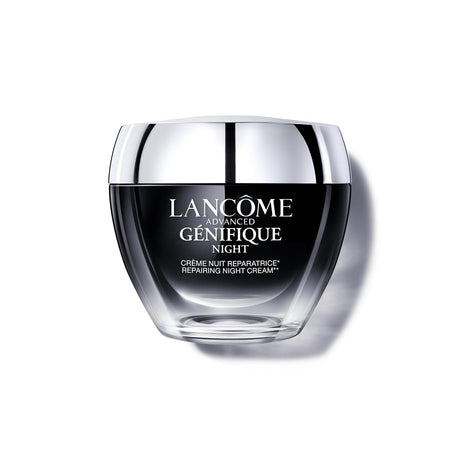 Lancome Genifique Night Repair Cream jar with silver lid on a clean background. The product packaging appears sleek and premium.