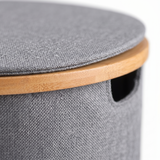 Close-up of laundry hamper lid and bamboo edge detail

