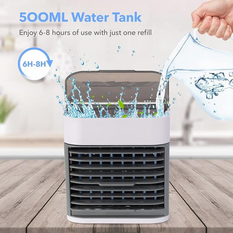 Portable USB air cooler being filled with water in a 500ML tank. Designed to provide 6–8 hours of continuous cooling use.