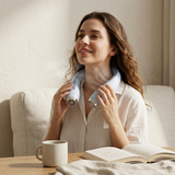 S5 Turbo bladeless neck fan worn, hands-free cooling during indoor relaxation
