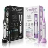 Two Soniclean Pro 4800 rechargeable toothbrushes are displayed side-by-side in their retail packaging, one in black and one in lilac. Each set includes the electric toothbrush handle on a charging base, a replacement brush head standing alongside, and a box highlighting features like "4 Unique Brush Modes" and "12 Total Brush Heads."