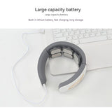 USB rechargeable neck massager charging via cable with large capacity battery. Device placed near laptop showing fast charging capability.