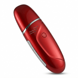 An angled image of the red ultrasonic facial cleansing device against a pure white background. The perspective highlights the sleek, ergonomic design and metallic finish of the product.