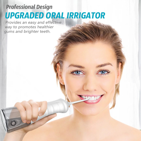Woman using oral irrigator to clean teeth and improve gum health and oral hygiene.