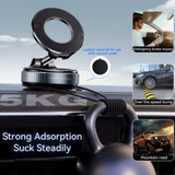 Vacuum magnetic phone mount installed on car dashboard holding weight steadily. Designed for strong suction during driving conditions.