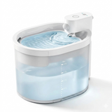 An angled image a white 2L cat water fountain featuring a semi-transparent tank and clear volume markings. This wireless dispenser shows clean water ripples in a minimalist, high-angle view.