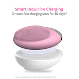Wireless silicone facial cleansing brush on inductive charging base. Fast charging feature displayed with long-lasting battery use.